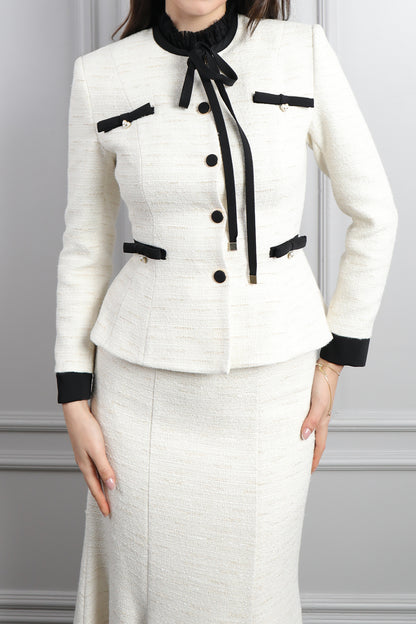 طقم تنورة وتوب رسمي بزينة فيونكات وتفصيل كشكشة عالياقة -سكري